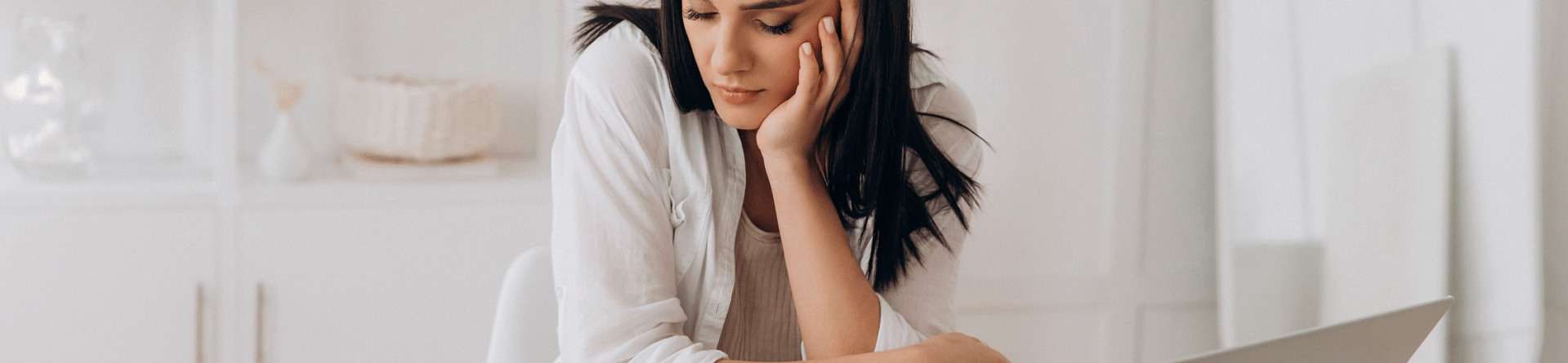 woman looking at bills